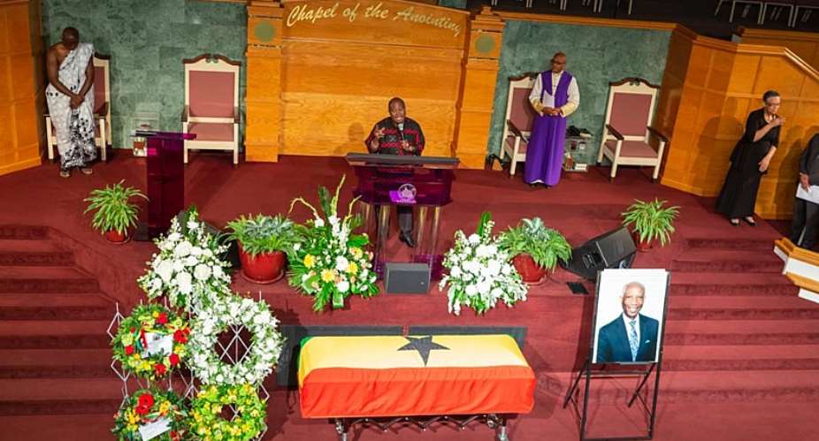 The casket draped in the national flag containing the body of Dr Botchwey at the funeral service.