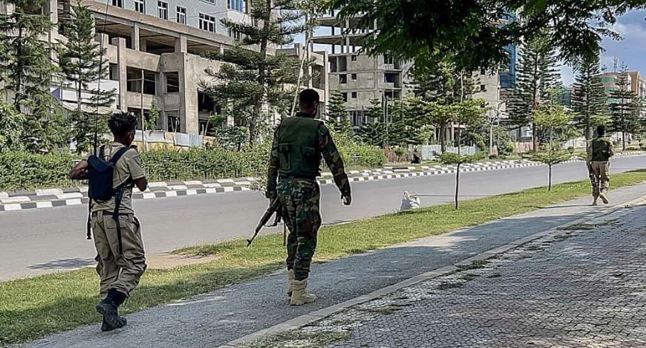 Members of the Tigray Peoples Liberation Front (TPLF) walk along a main road in Mekelle on 23 September 2026, as tensions intensify in northern Ethiopia after Tigrayan rebels seized control of airports in the region. -  AFP
