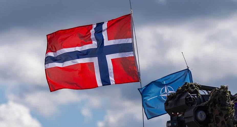 Norways and NATOs flags are seen during a military exercise on May 16, 2025. -  Mindaugas Kulbis, AP
