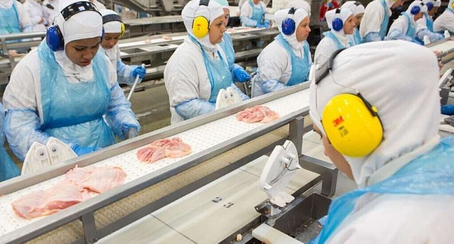 Employees are working on a production line at the JBS-Friboi chicken processing plant in the state of Paran, Brazil. - AFP - RODRIGO FONSECA