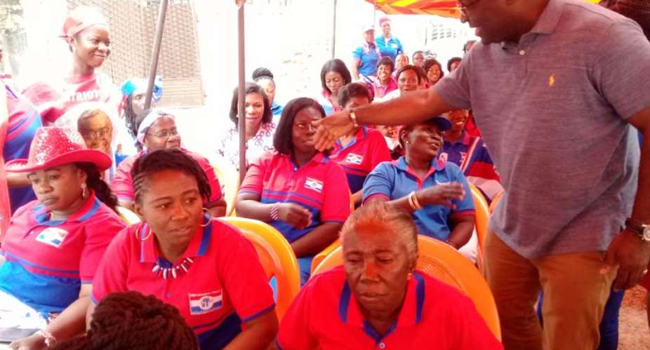 Eugene Boakye Antwi shaking hands with members of the NPP Women's Wing at Subin before the health screening exercise