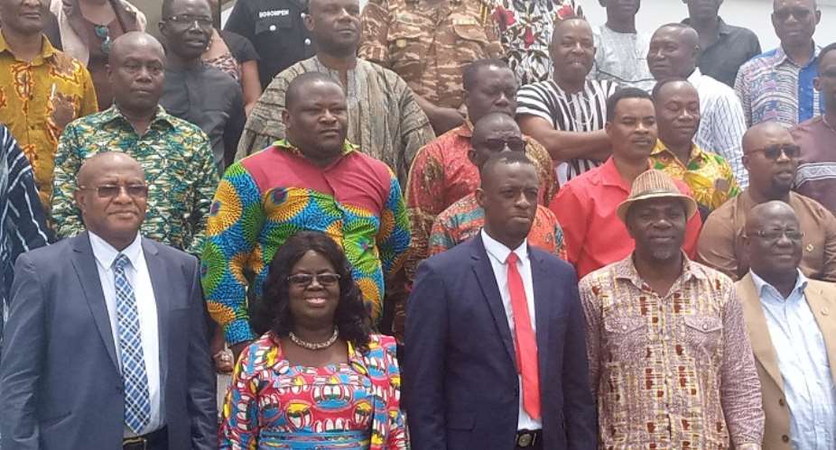 Okyere Darko-Mensah 3rd left in a photograph with the MMDAs and Heads of Departments