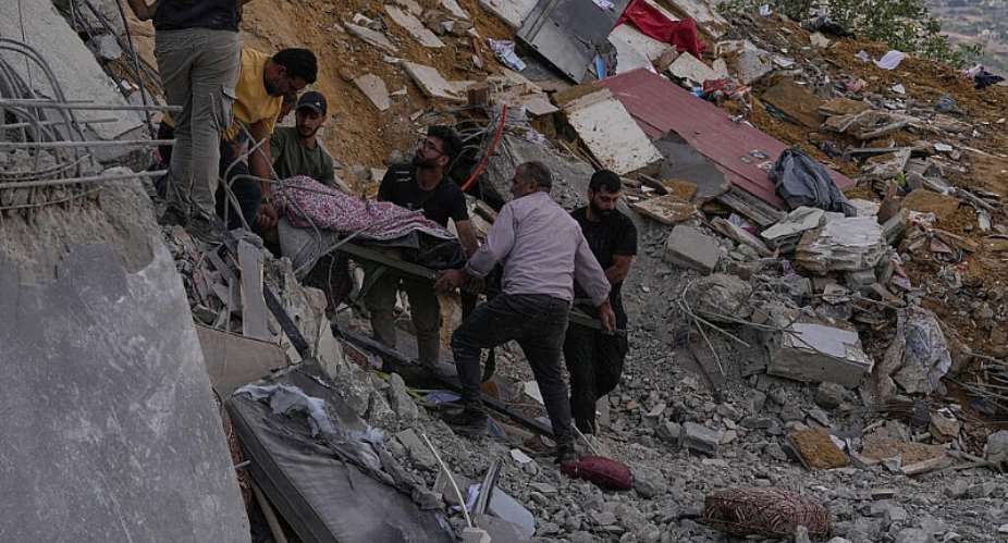 People carry the body of a person who was killed by an Israeli air strike on a house in Arab Salim village, southern Lebanon, on September 6, 2026. -  Mohammed Zaatari, AP