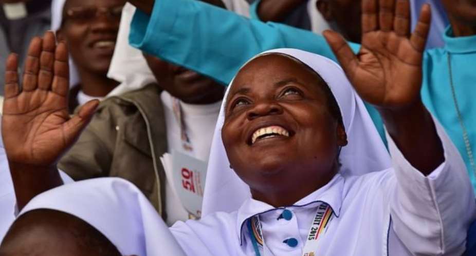 A nun reacts at Namugongo Martyrs' Shrine during an open air mass held by Pope Francis on November 28, 2015