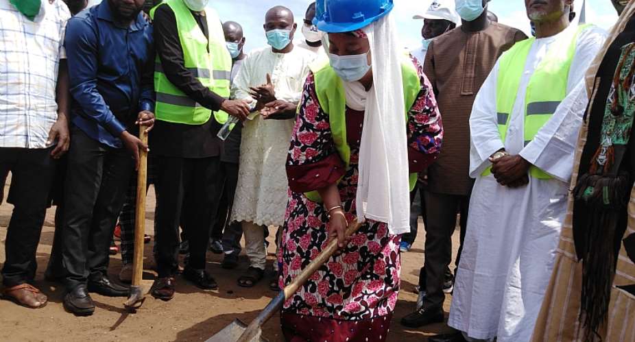 Hajia Salma, the Ayawaso East Mayor cutting sod for commencement of the project