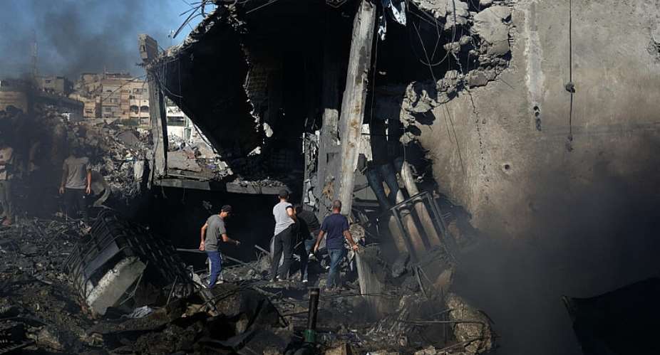 File - Palestinians inspect the rubble of a building destroyed in an Israeli airstrike in Gaza City on August 24, 2026. -  Jehad Alshrafi, AP