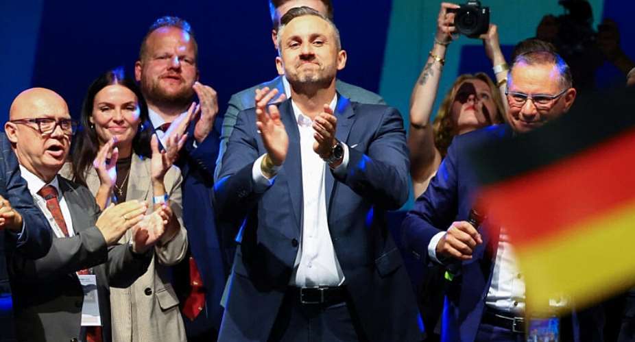 Ulrich Sigmund applauds on stage at an AfD election night party after the polling stations closed in the Saxony-Anhalt state election and exit poll results were announced in Magdeburg, Germany, on 6 September 2026 -  Fabrizio Bensch / Reuters
