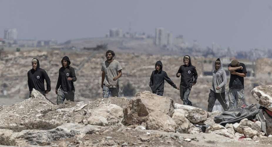 Israeli settlers arrive to confront left-wing activists at an Israeli outpost in the Israeli-occupied Palestinian village of Jannatah, just south of the city of Bethlehem on August 25, 2026. -  Ilia Yefimovich, AFP