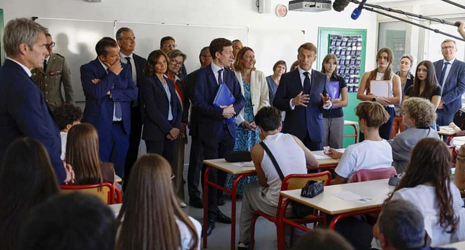 French President Emmanuel Macron, flanked by French Minister of Education Edouard Geffray, talks with students during his visit to the Chaptal High School on the first day of the new academic year in Mende, southern France, 1 September 2026. -   Guillaume Horcajuelo / via REUTERSeuters