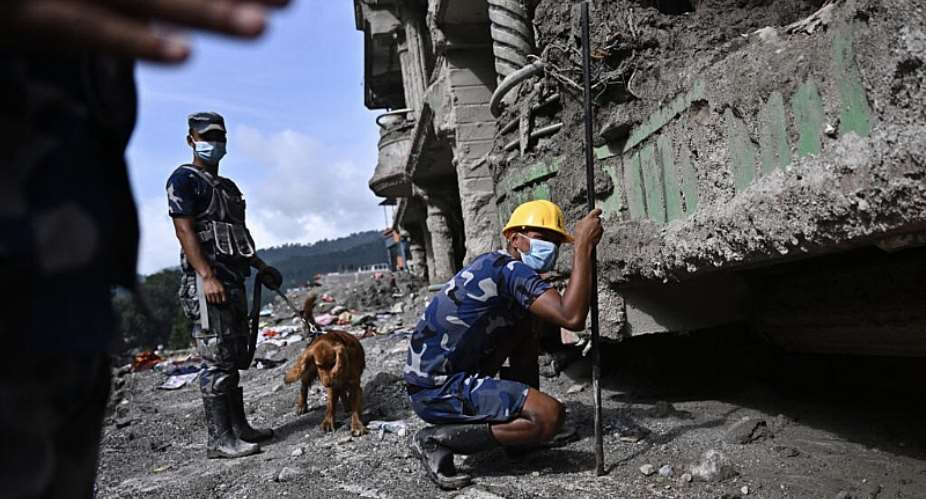 Police rescue workers search for survivors in the aftermath of flash floods at Trishuli in Nepals Nuwakot district on September 7, 2026 -  Pedro Pardo, AFP
