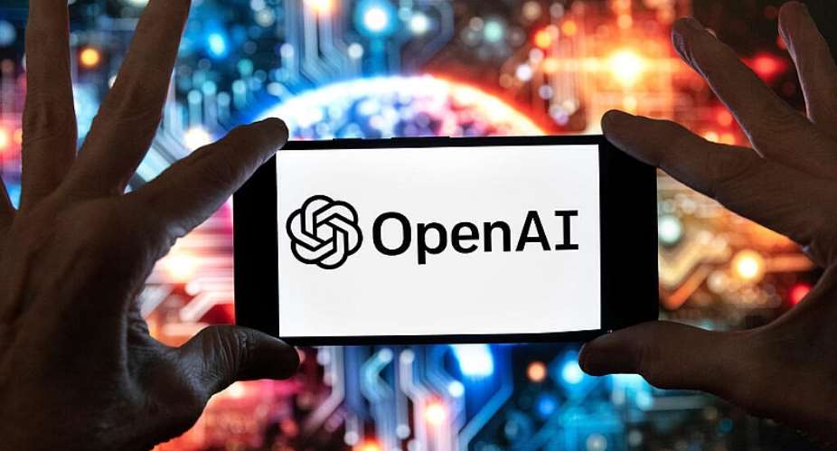The OpenAI logo is displayed on a cell phone in front of an image generated by ChatGPTs Dall-E text-to-image model, December 8, 2023, in Boston. -  Michael Dwyer, AP