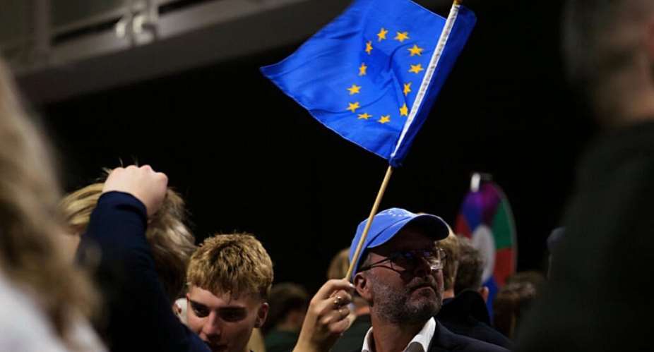A supporter waves a European Union flag during an election-night gathering for the yes in Reykjavik, Iceland, Sunday, Aug. 30, 2026. -  Marco Di Marco / AP