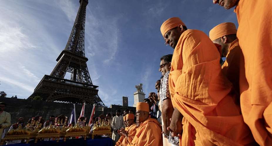 Bochasanwasi Akshar Purushottam Swaminarayan Sanstha (BAPS) Hindu monks participate in a religious ceremony in front of the Eiffel Tower on September 3, 2026. -  Kenzo Tribouillard, AFP