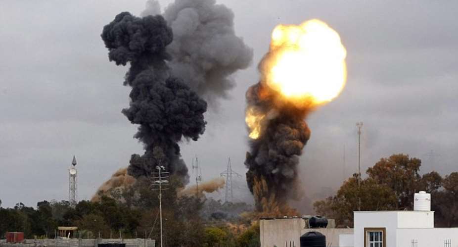 NATO bombs strike Kadhafi's neighborhood Photo credit MAHMUD TURKIAAFPGetty Images