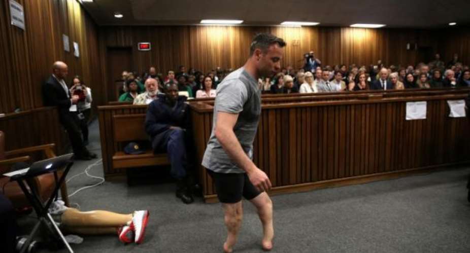 Pistorius walks on stumps to show court his disability