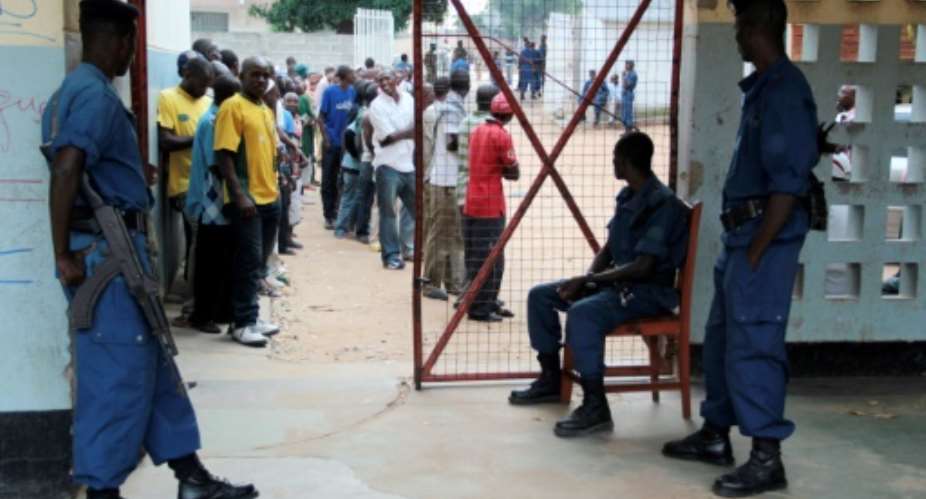 Residents queue at a polling station in Burundi's capital Bujumbura to vote in the parliamentary elections on June 29, 2015.  By Landry Nshimiye AFP