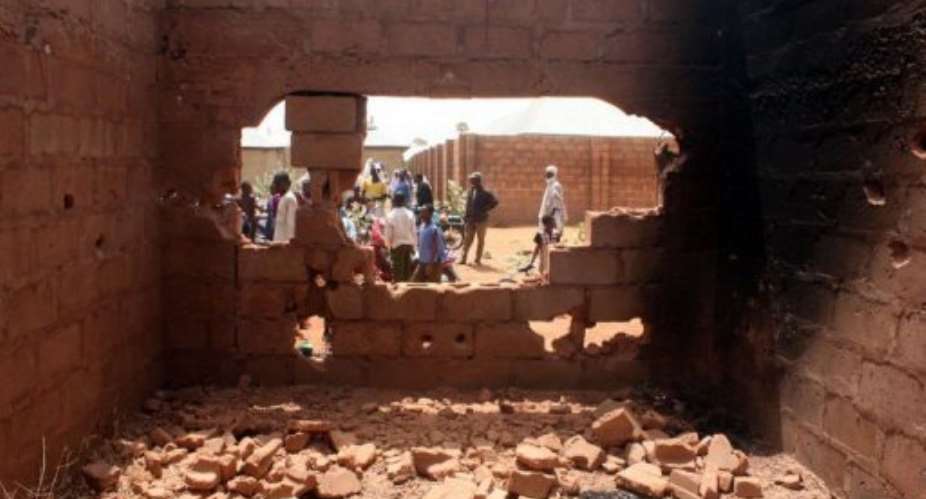 A building where tires were burnt while kidnappers attempted to escape during the failed rescue operation of hostages.  By Emmanuel Arewa (AFP)