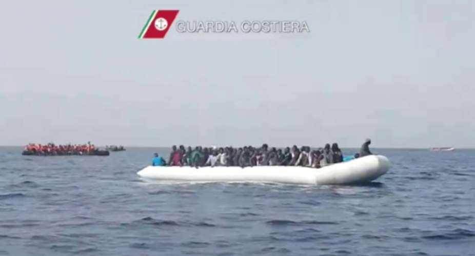 A picture released by Italian Coast Guards shows a rescue operation in May of a boat carrying migrants off the coast of Sicily.  By Str AFPFile
