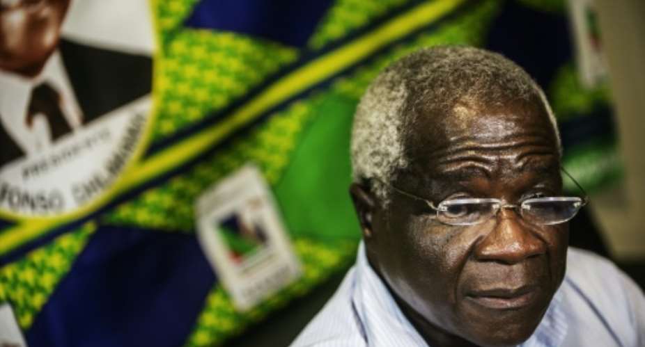 Mozambican Resistance Movement RENAMO presidential candidate Afonso Dhlakama centre speaks during an interview in Maputo on October 11, 2014.  By Gianluigi Guercia AFPFile