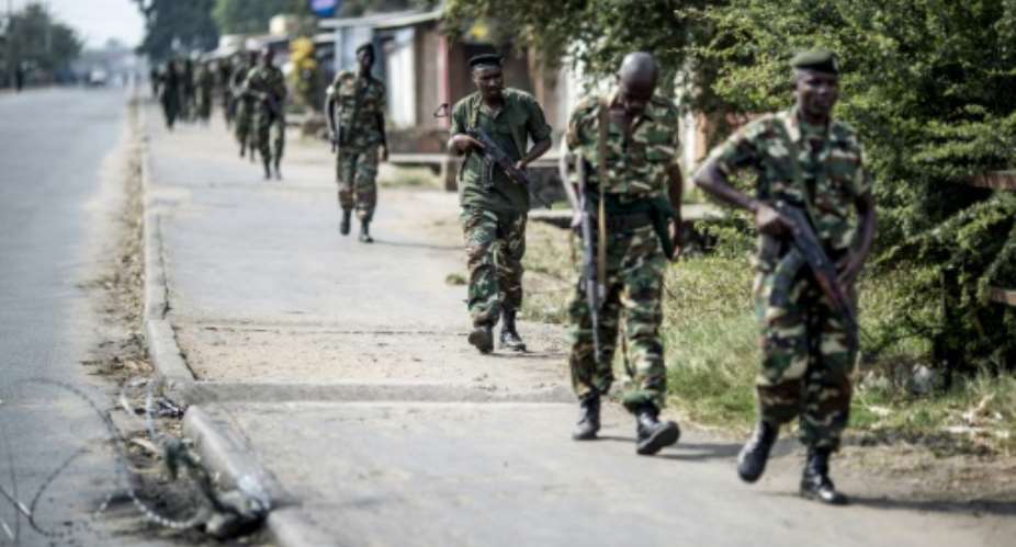 Burundian soldiers on patrol in the Cibitoke neighbourhood in Bujumbura.  By Marco Longari AFPFile