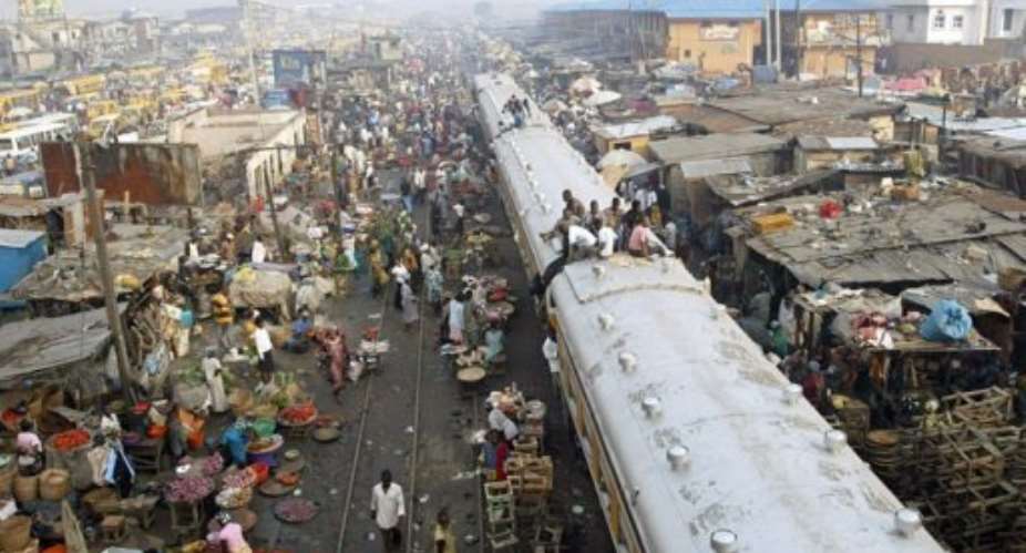 Commuters sit on coaches of a train in Lagos, Nigeria, in 2007.  By Pius Utomi Ekpei AFPFile