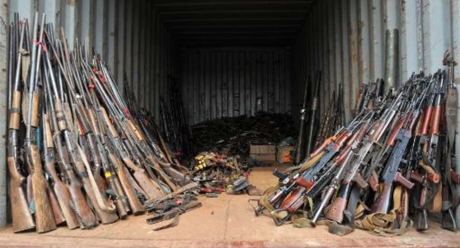 Weapons gathered by French soldiers of the Sangaris military operation and seized from Christian vigilantes at the Mpoko camp in Bangui, Feruary 7, 2014.  By Issouf Sanogo AFPFile