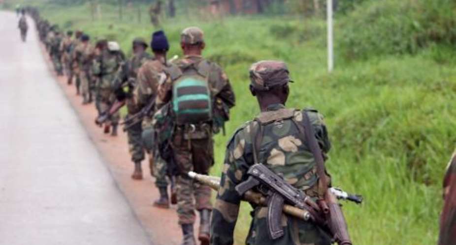 Democratic Republic of Congo FARDC soldiers marc towards the front line in Eringeti to fight against the Allied Democratic Forces and the National Army for the Liberation of Uganda ADF-Naluon December 31, 2013.  By Alain Wandimoyi AFPFile
