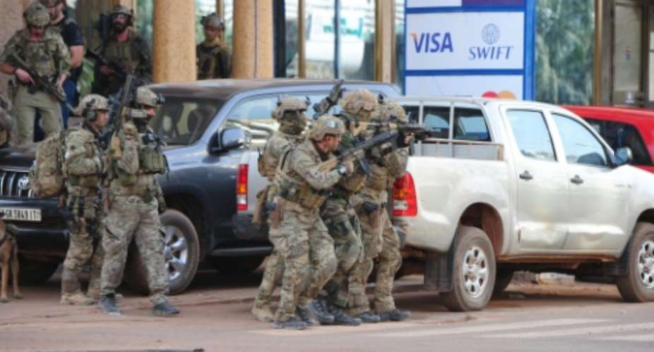 French special forces take position near the Splendid hotel in Ouagadougou on January 16, 2016 following an attack by Al-Qaeda linked gunmen.  By Ahmed Ouoba AFP