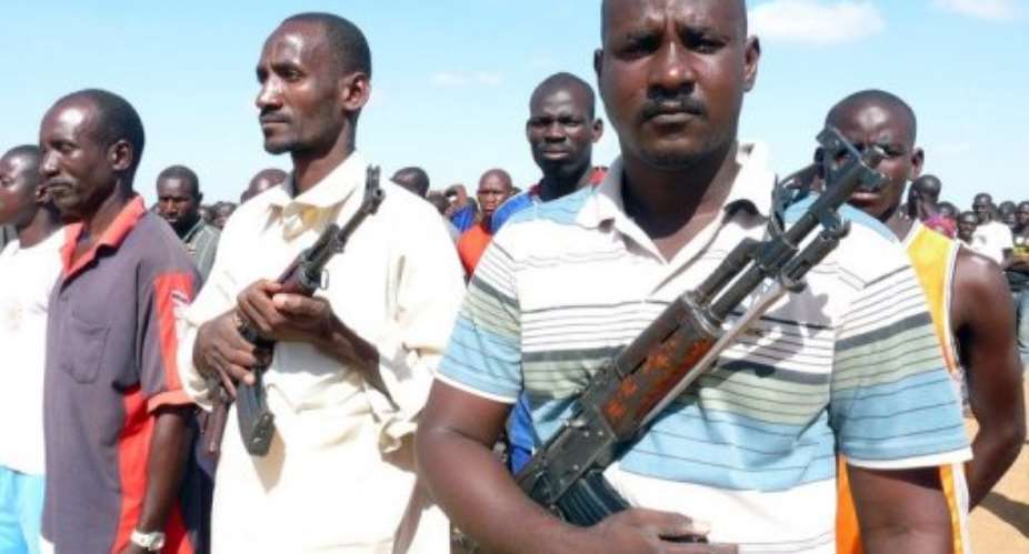 Some 300 Malian civilians receive military training from an army instructor.  By  (AFP/File)