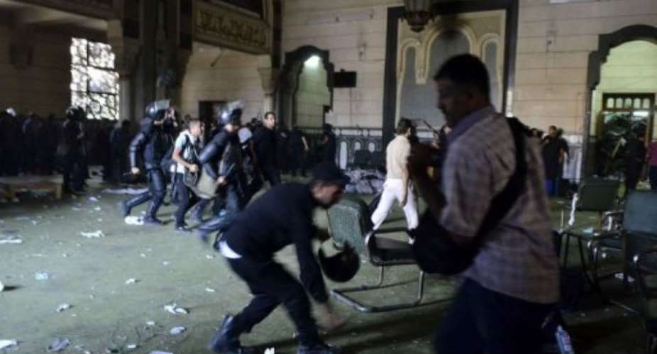 Egyptian riot policemen in Cairo's Al-Fath mosque where Islamist supporters of ousted Morsi holed up on August 17, 2013.  By Mohamed el-Shahed AFPFile