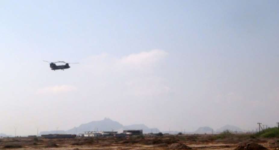 A military helicopter flies as it evacuates wounded people after a rocket attack on October 6, 2015 on the outskirts of the embattled southern city of Aden in Yemen.  By Saleh Al-Obeidi AFPFile