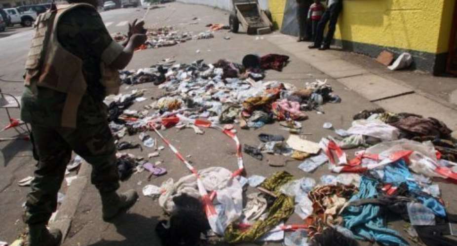 Clothing scattered on the pavement in Abidjan on January 1, 2013 following the stampede.  By Herve Sevi AFP