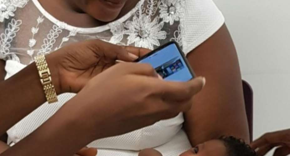 A baby is screened during a trial in a large-scale feasibility study using a smartphone-based screening for jaundice at Greater Accra Regional Hospital in Accra, Ghana in this undated handout photo from the University of Ghana.  By Christabel Enweronu-Laryea University of GhanaAFP