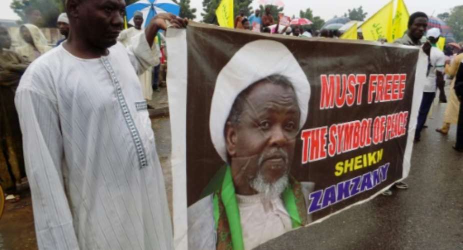 A banner with the image of pro-Iranian Shiite Muslim cleric Ibrahim Zakzaky, who who has been held in custody for more than two years in Nigeria.  By Aminu Abubakar AFPFile