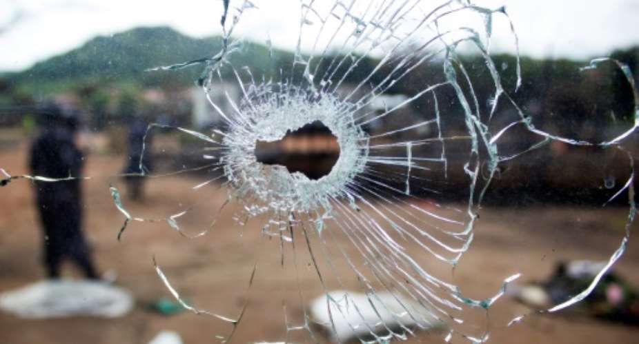 A bullet hole in a window after fighting, in Kasese, Uganda in December 2016.  By Badru KATUMBA AFPFile