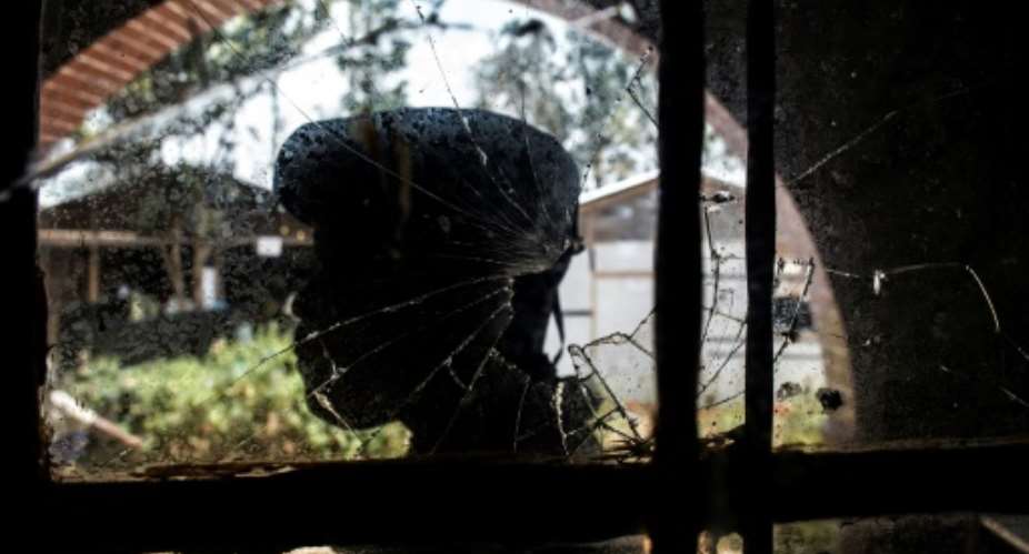 A bullet-shattered window at an Ebola treatment centre in Butembo after it came under attack on March 9. A policeman was killed and a health worker wounded.  By JOHN WESSELS AFP