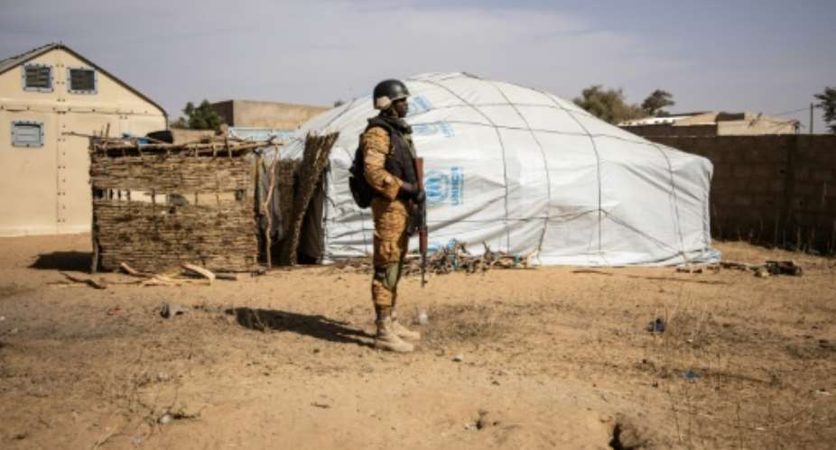 A Burkina Faso soldier patrols at a camp in Dori sheltering people displaced from northern Burkina Faso..  By OLYMPIA DE MAISMONT AFPFile