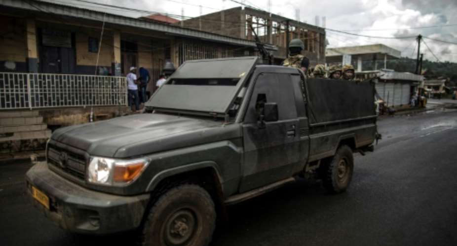 A Cameroonian Army armoured vehicle patrols the streets of the majority English-speaking Southwest province capital of Buea, a region in the grip of an armed revolt by anglophones demanding independence from the majority French-speaking country.  By MARCO LONGARI AFPFile