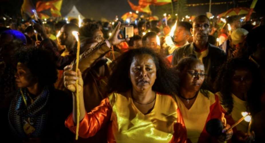 A candle-lit parade in Mekele, the capital of Tigray region, took place on the eve of celebrations for the founding of the TPLF, Ethiopia's once-dominant party.  By MICHAEL TEWELDE AFP