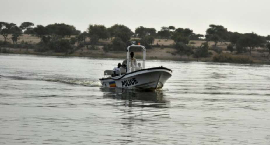 A Chadian police vessel patrols on Lake Chad near the border with Cameroon and Nigeria.  By SIA KAMBOU AFPFile