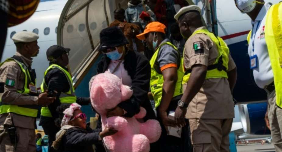 A chartered plane carrying Nigerian nationals landed at Lagoss Murtala Mohammed International Airport.  By TOYIN ADEDOKUN (AFP)