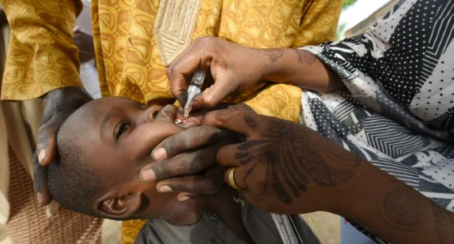 A child in Kano, northwest Nigeria receives the vaccine in 2017.  By PIUS UTOMI EKPEI AFPFile