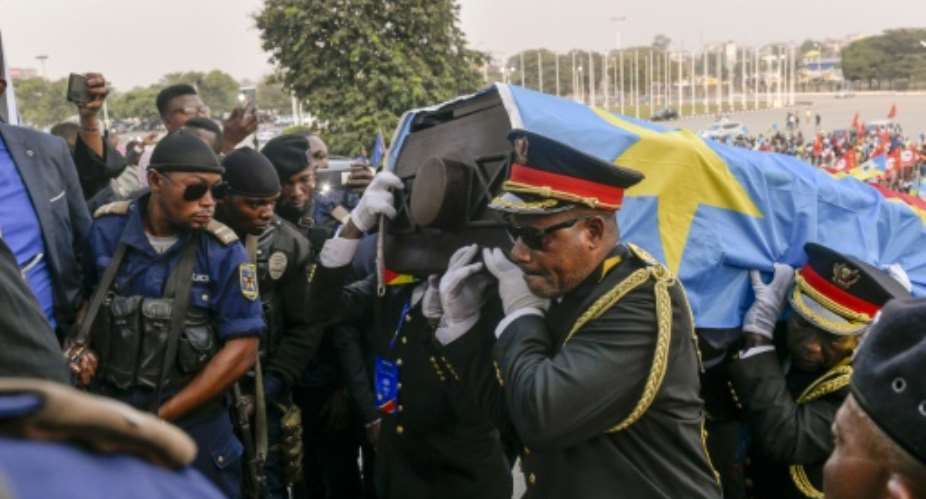 A coffin bearing Lumumba's remains was taken to parliament for commemoration on Wednesday, the eve of the interment.  By Arsene Mpiana AFP