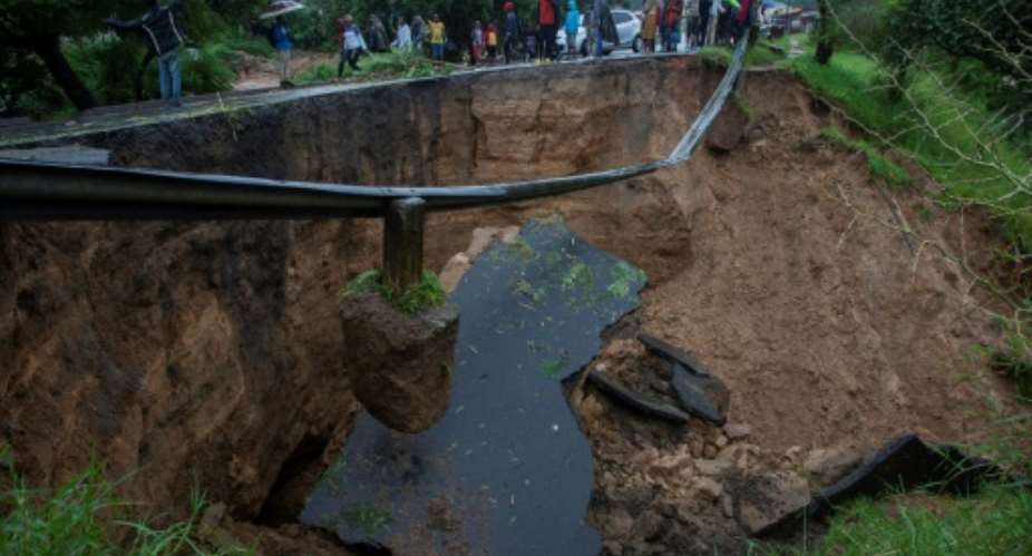 A collapsed road caused by floods from Freddy's torrential rains in Blantyre, Malawi, on Monday.  By Amos Gumulira AFP