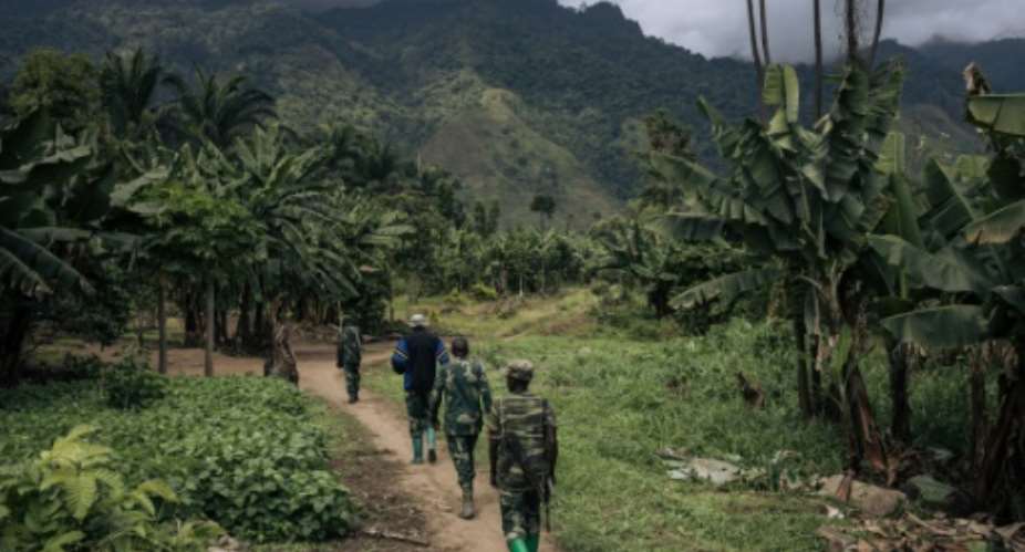 A Congolese patrol pictured in May in the Rwenzori sector near the Ugandan border. The area has suffered repeated ADF attacks.  By ALEXIS HUGUET AFP