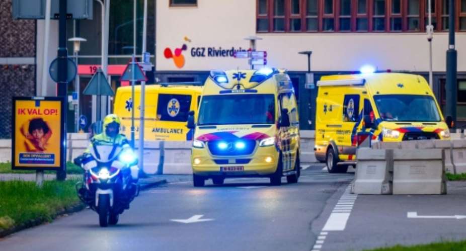 A convoy of ambulances believed to be carrying passengers evacuated from the cruise ship is escorted by Dutch police on motorcycles as it arrives at Leiden University Medical Center.  By Josh Walet (ANP/AFP)