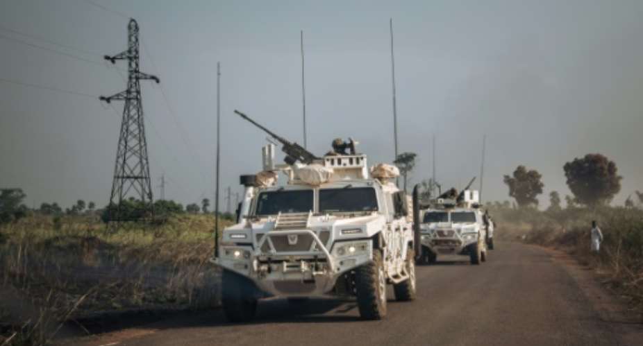 A convoy of commercial vehicles escorted by MINUSCA was blocked on a major highway after fighting broke out between armed groups and CAR forces.  By ALEXIS HUGUET (AFP)