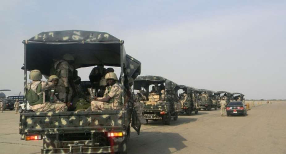 A convoy of soldiers pictured in Kaduna, northern Nigeria on January 17, 2013.  By Victor ULASI AFPFile