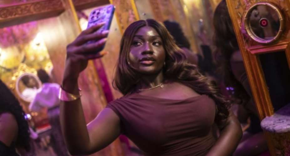 A dedicated selfie space in the womens restroom of Zaza, a restaurant and lounge in Lagos,  offers patrons over-the-top decor and mirrors.  By OLYMPIA DE MAISMONT (AFP)