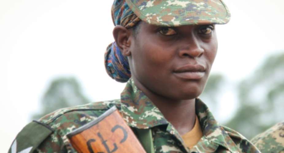 A female Soldier of the Uganda People's Defense Force UPDF attends a special event in Uganda in April before her contingent started its service with the UN-backed African Union Mission in Somalia AMISOM.  By Gael Grilhot AFPFile